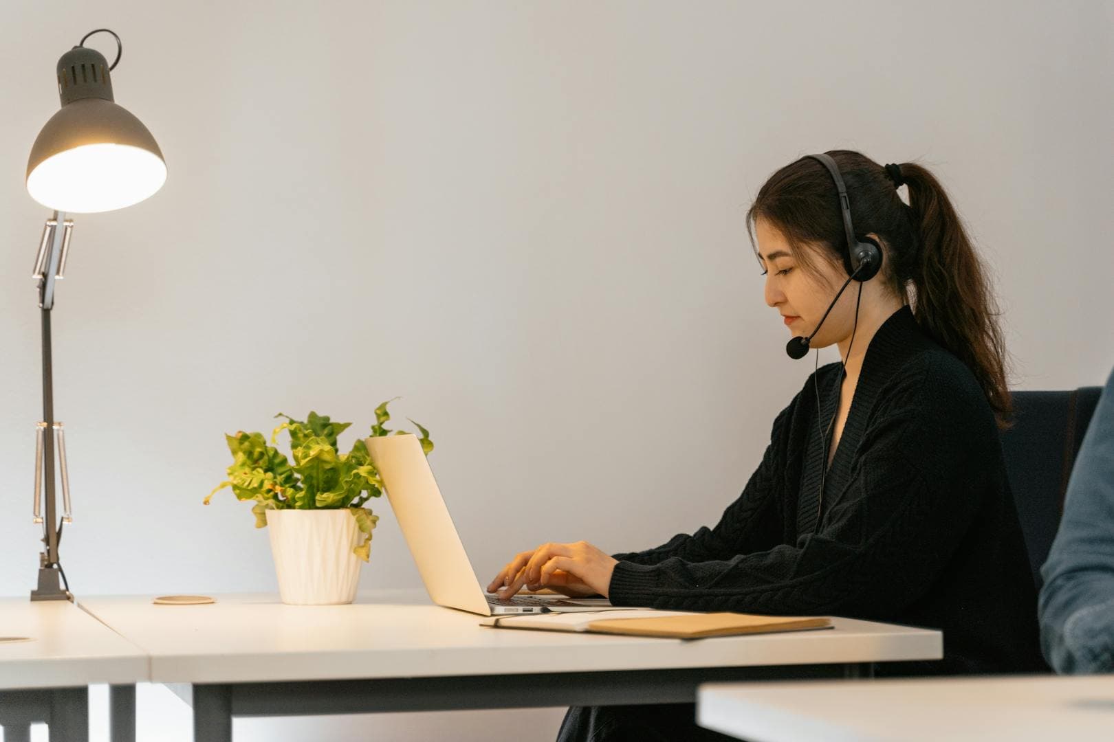 Professional court reporter wearing a headset while transcribing legal proceedings
