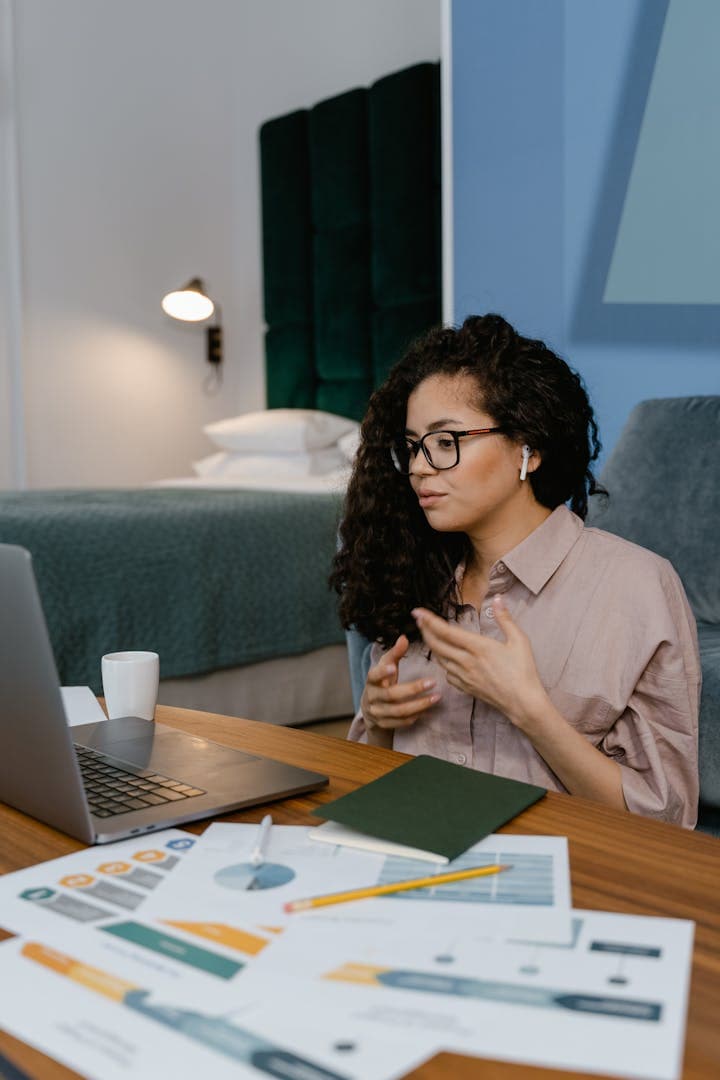 Attorney conducting a remote deposition via video conference from a professional office
